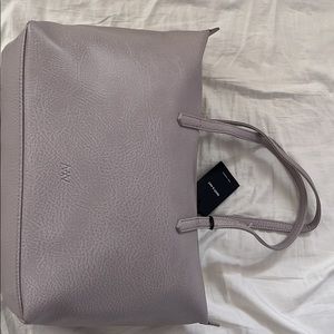 Matt and Nat Abbi tote in Serene. Brand new bought for $140